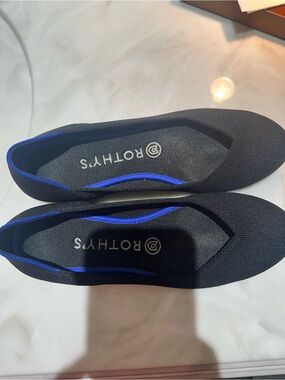 Rothy's Black Knit Slip-On Flats with Blue Accent